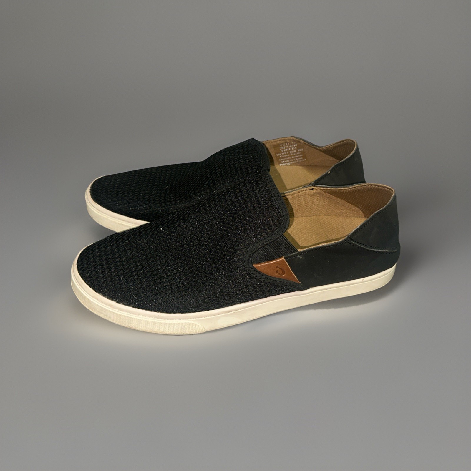 OluKai Women’s Pehuea Sneaker Black Slip On – 9.5 Air Mesh Vamp Leather Accents
