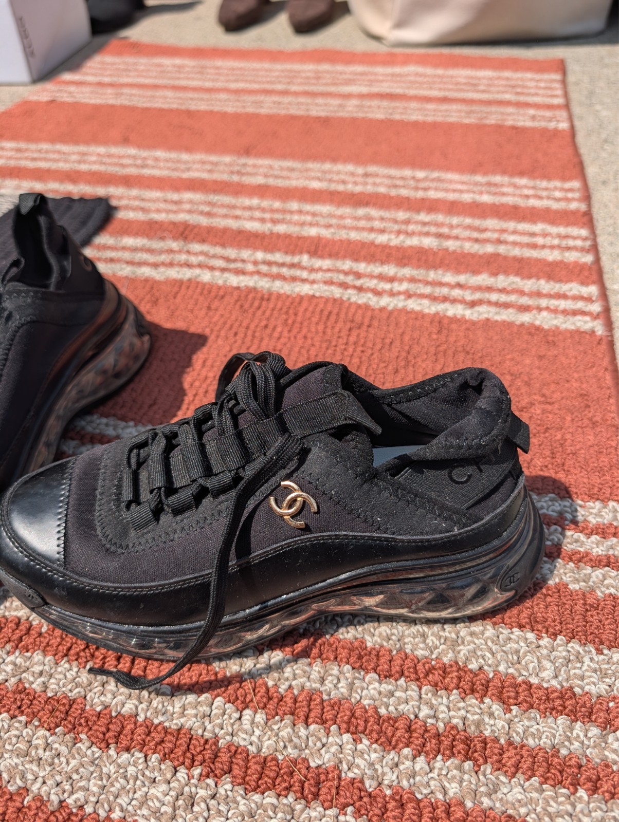 chanel lace up all black sneakers