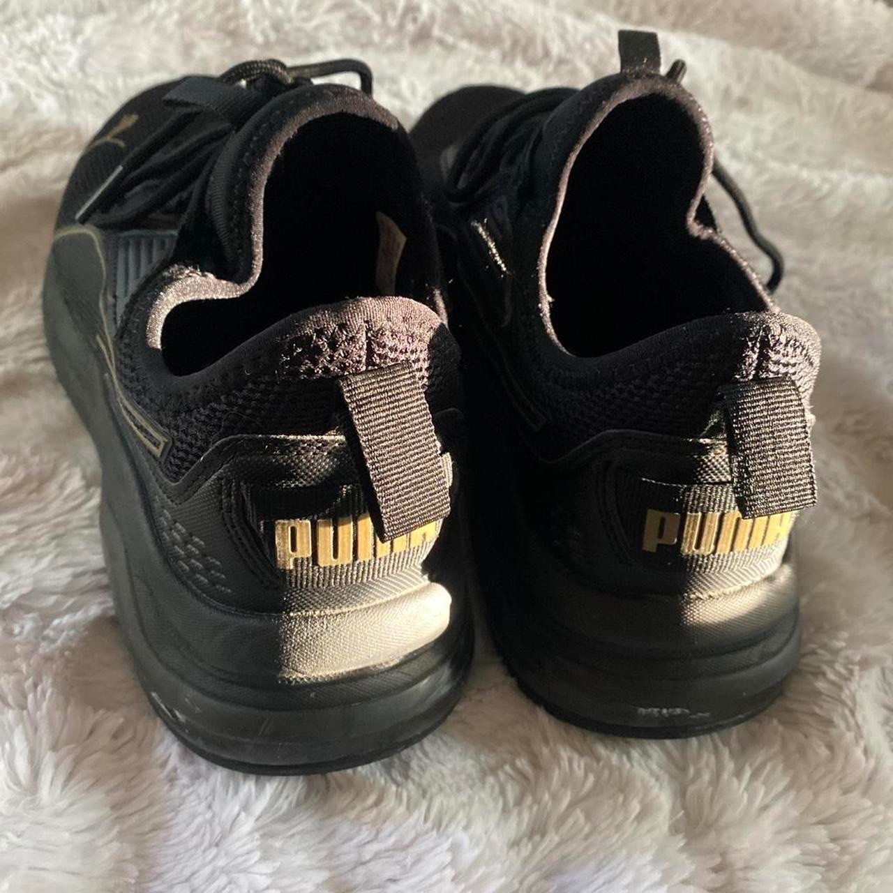 female black puma shoes