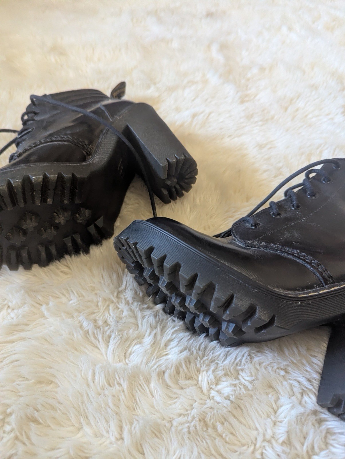Black leather Dr. Martens Persephone heeled boots featuring a padded collar US 7