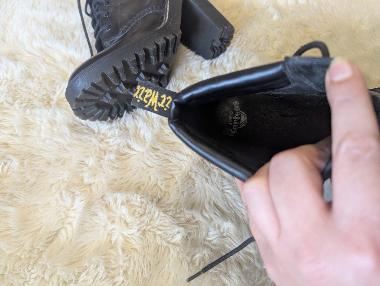 Black leather Dr. Martens Persephone heeled boots featuring a padded collar US 7