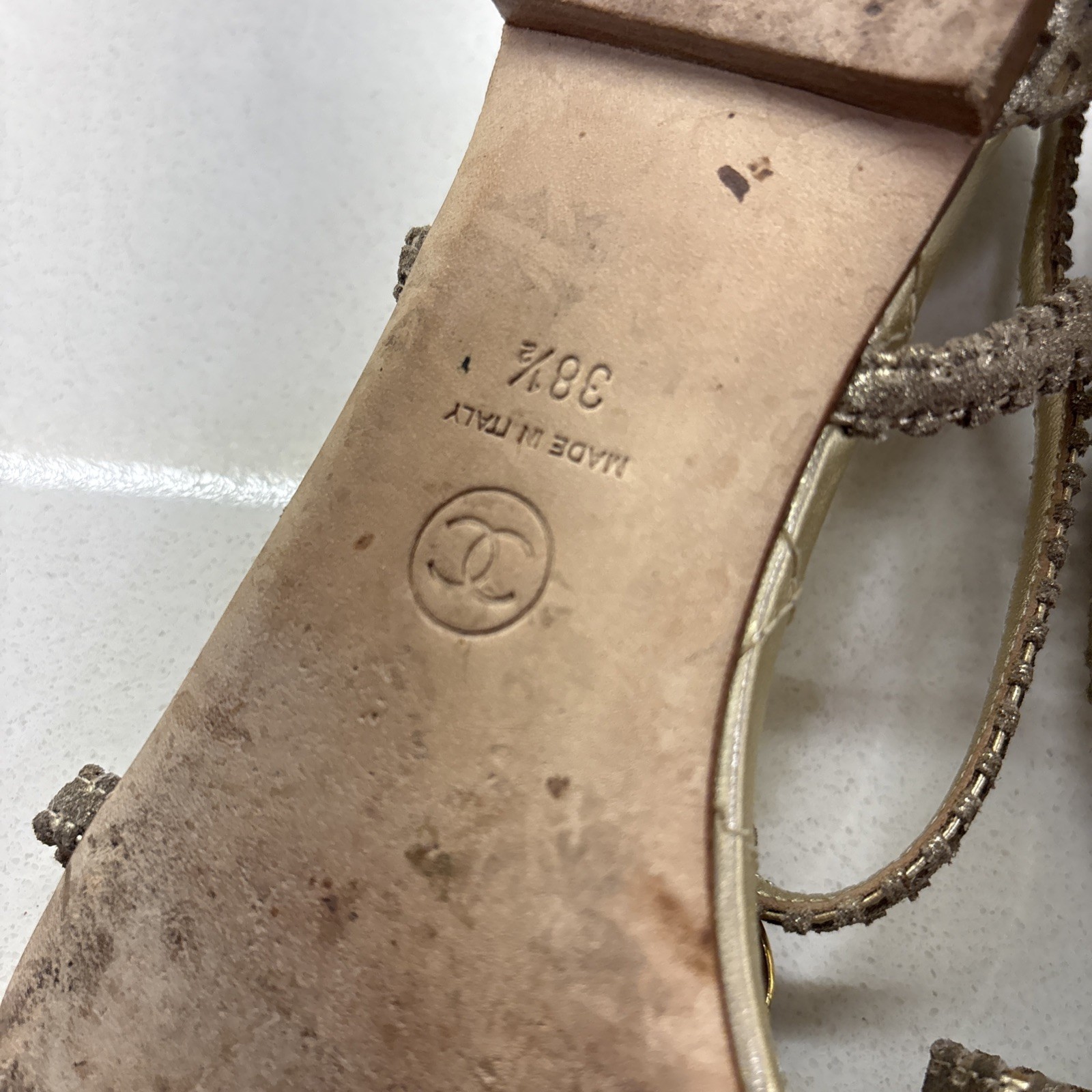 Chanel Gold Quilted CC Camellia Sandals, featuring a metallic bronze flower—EUC