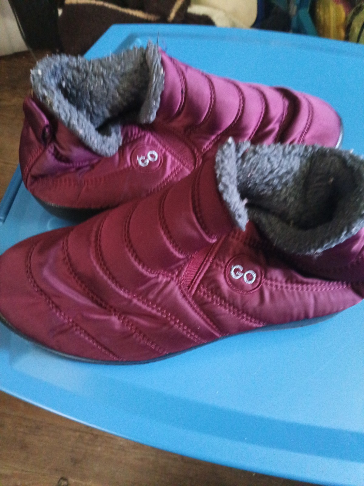 Go brand quilted maroon snow boots feature a plush faux fur lining and a slip-on